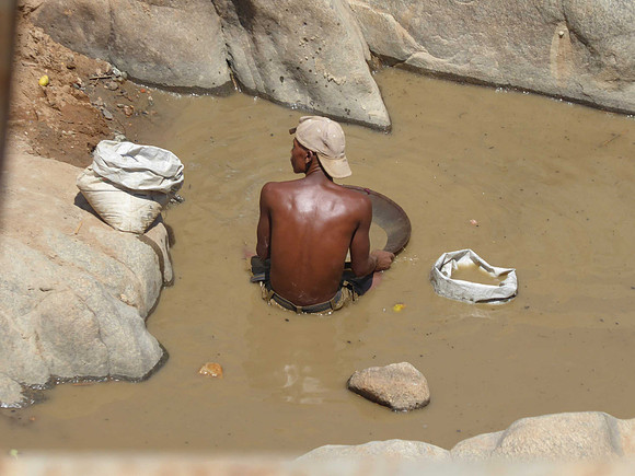 Panning for gold in a river