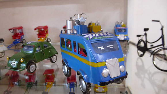 Model cars and bicycles, handmade from drink cans