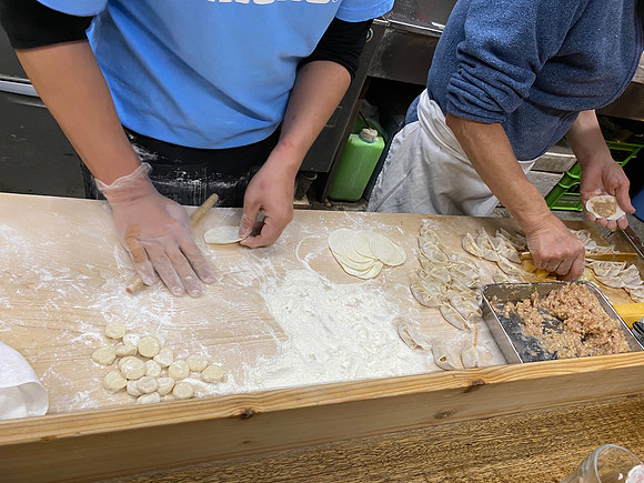 Preparing gyoza dumplings